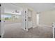 Large bedroom featuring plush carpeting, a ceiling fan, and backyard views at 2647 Hourglass Dr, Henderson, NV 89052