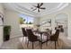 Cozy dining area with a view of the pool through a large window at 2647 Hourglass Dr, Henderson, NV 89052