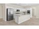 Modern kitchen with white cabinetry, stainless steel appliances, and granite countertops at 2647 Hourglass Dr, Henderson, NV 89052