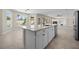 Kitchen island with granite countertop, stainless steel dishwasher, sink, and backyard views at 2647 Hourglass Dr, Henderson, NV 89052