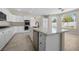 Spacious kitchen with white cabinets, granite countertops, and stainless-steel appliances at 2647 Hourglass Dr, Henderson, NV 89052