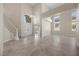 Spacious living room with high ceilings and large windows filling the room with light at 2647 Hourglass Dr, Henderson, NV 89052