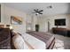 Comfortable main bedroom with a ceiling fan, an ensuite bathroom, and ample space at 2647 Hourglass Dr, Henderson, NV 89052