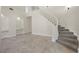 Elegant staircase with carpeted steps, leading to the upper level at 2647 Hourglass Dr, Henderson, NV 89052