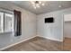Neutral bedroom featuring hard wood floors and modern lighting at 2679 Regency Cove Ct, Las Vegas, NV 89121