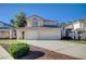 Charming two-story home with a two-car garage and well-maintained front yard landscaping and beautiful architecture at 2679 Regency Cove Ct, Las Vegas, NV 89121