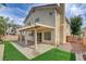 Two-story home featuring a covered patio, low-maintenance yard, and neutral stucco facade at 2679 Regency Cove Ct, Las Vegas, NV 89121