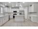 Modern kitchen with stainless steel appliances and island, complemented by ample counter space at 2679 Regency Cove Ct, Las Vegas, NV 89121