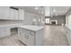Open-concept space with tiled floors, flowing into a kitchen and living area at 2679 Regency Cove Ct, Las Vegas, NV 89121