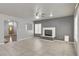 Comfortable living area with a fireplace, tile flooring, and neutral tones, creating a cozy and inviting space at 2679 Regency Cove Ct, Las Vegas, NV 89121