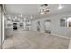 Open-concept living space with tile flooring, seamless transition to the kitchen, and a bright, airy atmosphere at 2679 Regency Cove Ct, Las Vegas, NV 89121