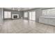 Spacious living room featuring a fireplace, neutral tones, and tile flooring at 2679 Regency Cove Ct, Las Vegas, NV 89121