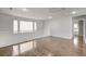 Bright loft featuring hardwood floors, white railing, and natural light at 2679 Regency Cove Ct, Las Vegas, NV 89121