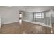 Second floor loft with hardwood floors, white banister, and ample natural light at 2679 Regency Cove Ct, Las Vegas, NV 89121