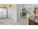 Kitchen with tile flooring, a closet, pantry, and an open view into the living room at 2837 Du Barry Manor Ln, Las Vegas, NV 89108