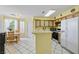 Kitchen with a breakfast nook, counter seating, tile flooring, and ample natural light at 2837 Du Barry Manor Ln, Las Vegas, NV 89108