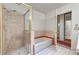 Bathroom showcasing a shower, soaking tub, and tiled walls at 2851 S Valley View Blvd # 1196, Las Vegas, NV 89102