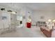 Open-concept living space with dining area, neutral carpet, and bright lamps at 2851 S Valley View Blvd # 1196, Las Vegas, NV 89102