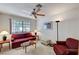 Cozy living room featuring a large window, ceiling fan, and comfortable furniture arrangement at 2851 S Valley View Blvd # 1196, Las Vegas, NV 89102