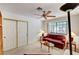Bright living room features neutral walls, a ceiling fan, and ample natural light from the large window at 2851 S Valley View Blvd # 1196, Las Vegas, NV 89102