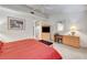 Bedroom featuring a comfortable bed, dresser, and large window at 2851 S Valley View Blvd # 1196, Las Vegas, NV 89102