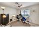 Bright office space with a ceiling fan, large window, and two work stations at 2851 S Valley View Blvd # 1196, Las Vegas, NV 89102