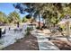 Picturesque walking path near the pool area, featuring mature trees and a tranquil setting at 2851 S Valley View Blvd # 1196, Las Vegas, NV 89102