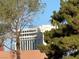Building with large windows seen through leafy trees at 2989 Bel Air Dr, Las Vegas, NV 89109