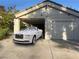 Exterior of a charming home featuring a carport, garage, and a luxurious white convertible at 2989 Bel Air Dr, Las Vegas, NV 89109