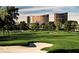 Picturesque golf course featuring a sand trap, green fairway, and luxury hotels in the distance at 2989 Bel Air Dr, Las Vegas, NV 89109