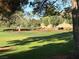 Picturesque view of the manicured green space and mature trees, offering a peaceful and scenic backdrop at 2989 Bel Air Dr, Las Vegas, NV 89109