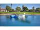 Small blue and white airplane partially submerged in a water hazard on the golf course at 2989 Bel Air Dr, Las Vegas, NV 89109