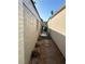 Side yard with gravel, decorative grasses, and walkway at 2989 Bel Air Dr, Las Vegas, NV 89109