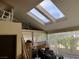 Bright sunroom with skylights, providing ample natural light and views of the outdoor greenery at 2989 Bel Air Dr, Las Vegas, NV 89109