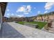 A spacious backyard features artificial turf, a gazebo, and an outdoor living area with landscaping at 313 Forsyth Park St, Las Vegas, NV 89138