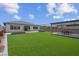 A spacious backyard features artificial turf, a gazebo, and an outdoor living area with landscaping at 313 Forsyth Park St, Las Vegas, NV 89138