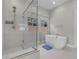 Elegant bathroom with a sleek glass-enclosed shower and a freestanding modern tub at 313 Forsyth Park St, Las Vegas, NV 89138