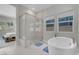 Contemporary bathroom with a glass shower and freestanding tub for a luxurious feel at 313 Forsyth Park St, Las Vegas, NV 89138
