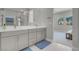 Modern bathroom with dual vanities, clean lines, and ample counter space for a spa-like experience at 313 Forsyth Park St, Las Vegas, NV 89138