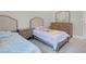 Cozy ' bedroom features two twin beds, matching nightstands, and a dresser with a mirror at 313 Forsyth Park St, Las Vegas, NV 89138