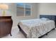 Cozy bedroom with a stylish bed, classic dresser, and ample natural light from the window at 313 Forsyth Park St, Las Vegas, NV 89138