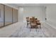 Dining area showing table, bench, chairs and sliding glass doors opening to the outdoors at 313 Forsyth Park St, Las Vegas, NV 89138