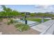Well-maintained community dog park featuring benches, green space, and waste disposal stations for residents' convenience at 313 Forsyth Park St, Las Vegas, NV 89138