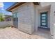 Close-up of home's modern front door and stone accents at 313 Forsyth Park St, Las Vegas, NV 89138
