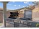 Close-up of the stainless steel outdoor grill with ample counter space, perfect for outdoor cooking and entertaining at 313 Forsyth Park St, Las Vegas, NV 89138