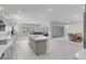 Spacious open-concept kitchen leading to the living room and dining area, featuring a large island and modern appliances at 313 Forsyth Park St, Las Vegas, NV 89138
