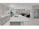 Bright, open-concept living space featuring a stylish kitchen island, light gray cabinets, and contemporary design at 313 Forsyth Park St, Las Vegas, NV 89138