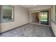 Covered patio area showcasing tiled flooring and views of the backyard, seamlessly connecting indoor and outdoor living spaces at 313 Forsyth Park St, Las Vegas, NV 89138