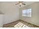 Light-filled bedroom with ceiling fan and wood-look flooring at 3318 N Decatur Blvd # 2129, Las Vegas, NV 89130