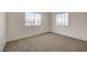 Bright bedroom offering neutral carpet and two large windows at 3318 N Decatur Blvd # 2129, Las Vegas, NV 89130